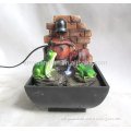 Resin table water fountain with two frogs on it